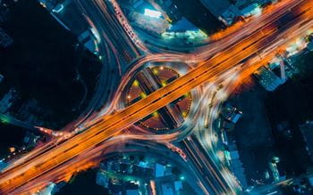 Aerial view of a busy traffic intersection at night