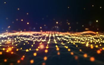 Picture of darks waves with golden bokeh dots on the surface leading away from the screen