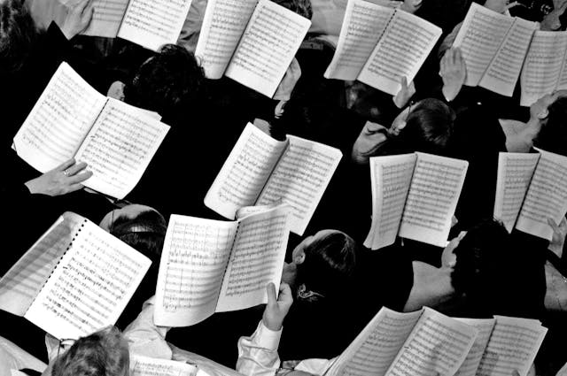 Choir with notes in hands, overhead view