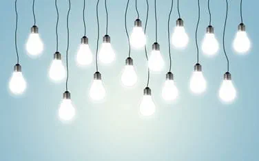 A row of lightbulbs hanging from the ceiling