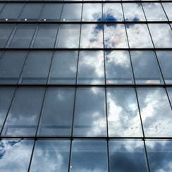 Image of clouds reflected in building windows