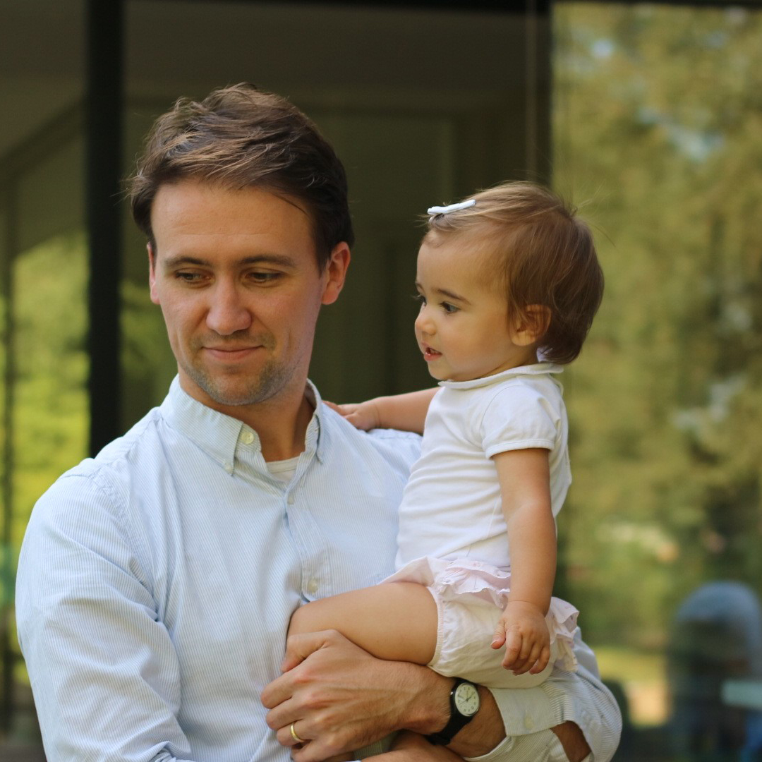 Niels De Weale holding a toddler