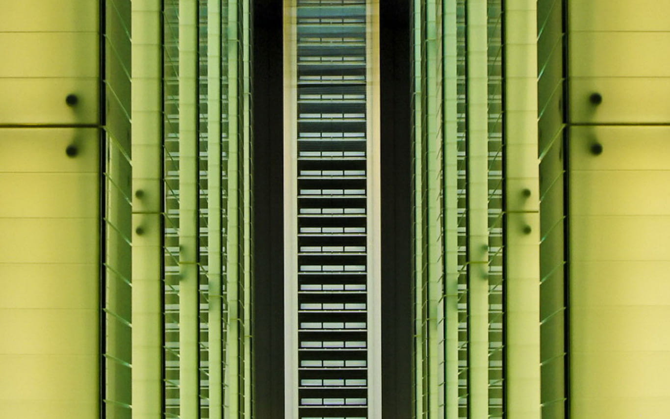 Close up of a modern green glass and metal building
