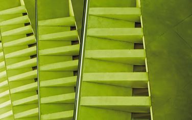 Close up of a modern green glass and metal building