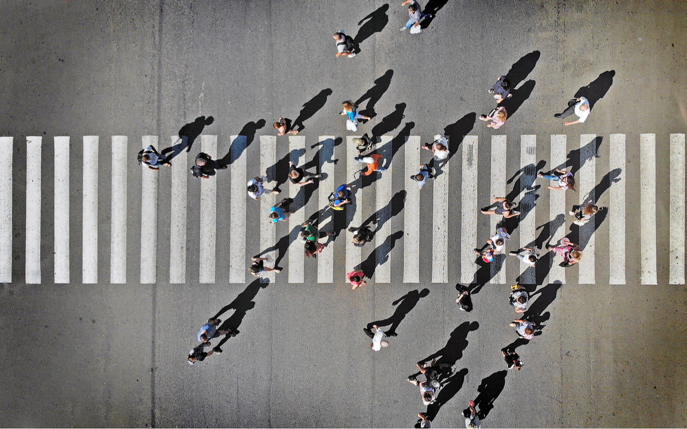 Aerial view of people crossing road