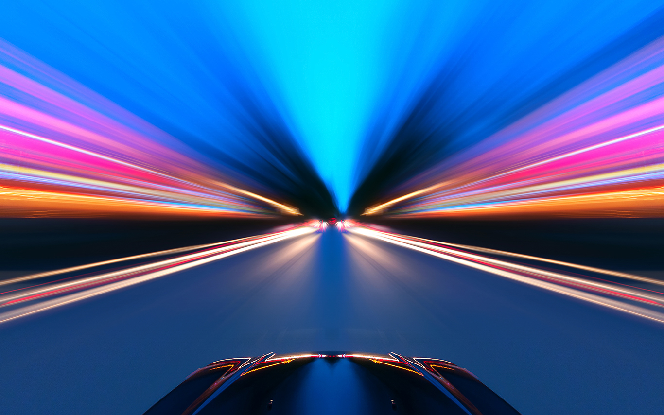 Car moving through tunnel, light blurred from movement