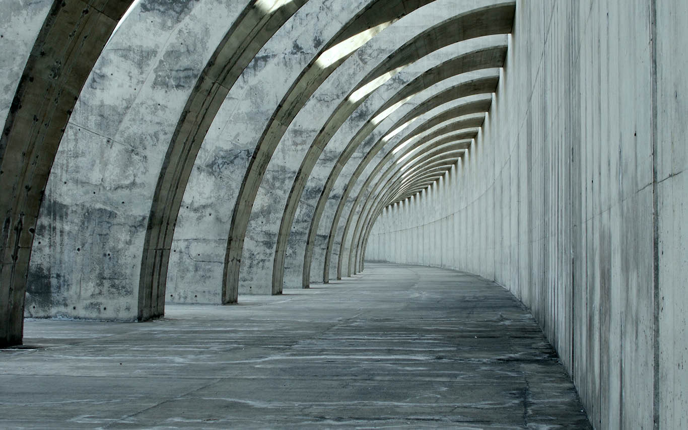 Concrete tunnel bending around a corner