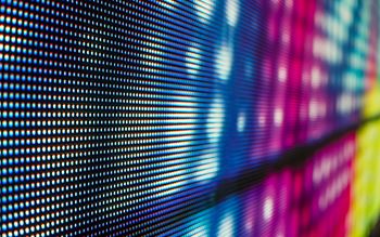 LED screen displaying a rainbow of coloured pixels