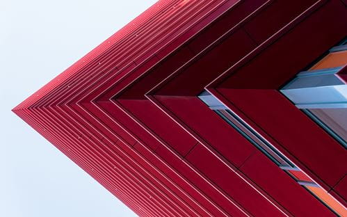 Red pointed edge of a high rise building