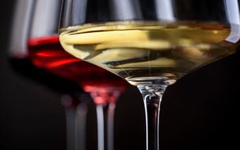 Close up of a glass of red wine and a glass of white wine