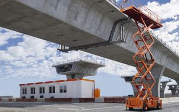 Heavy duty machinery building a bridge