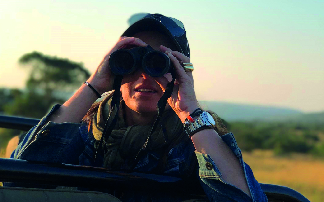 Jane Waters looking through binoculars
