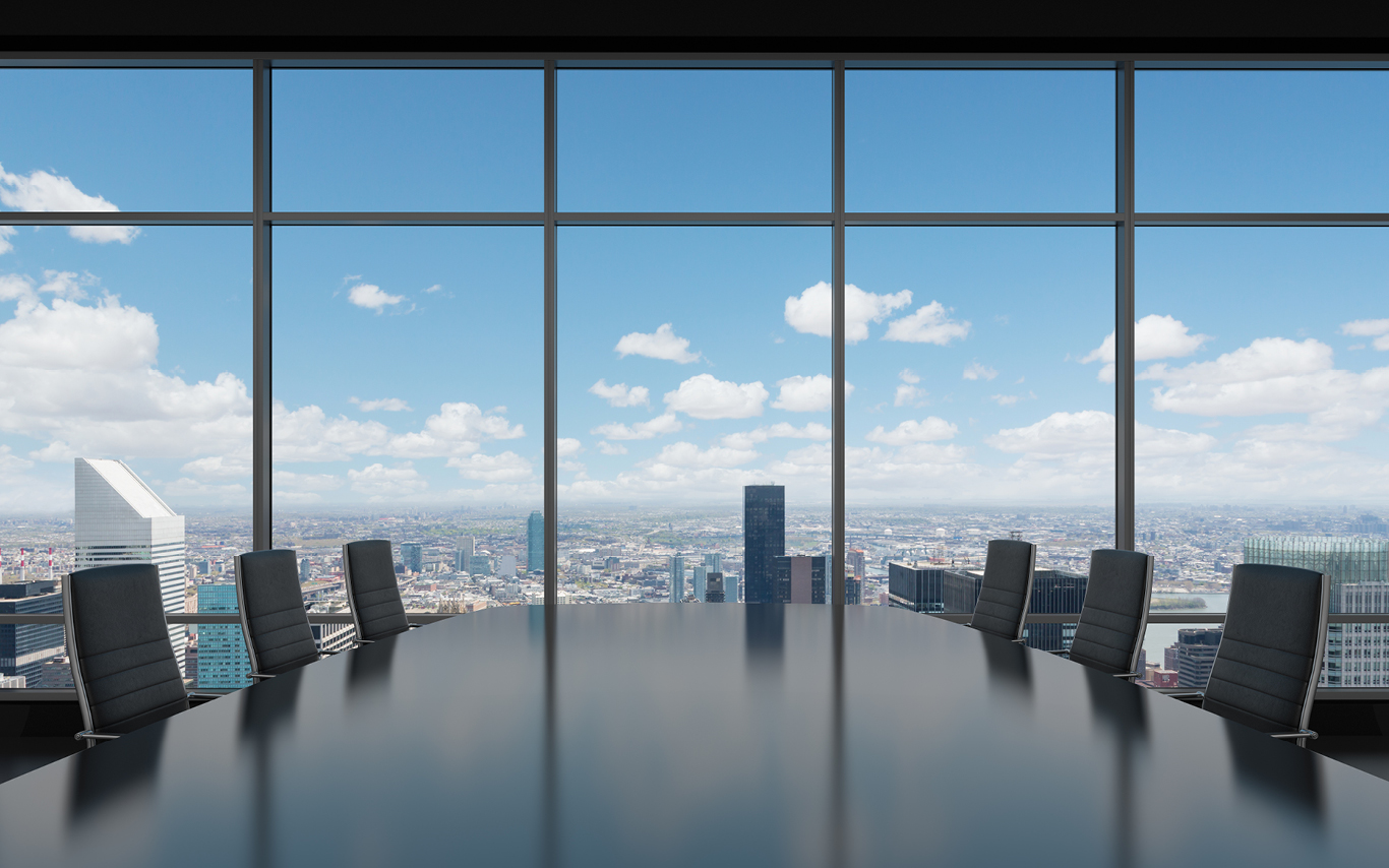 Office boardroom with city in the background