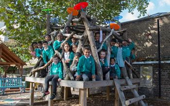 A group of primary school pupils having fun in the playground