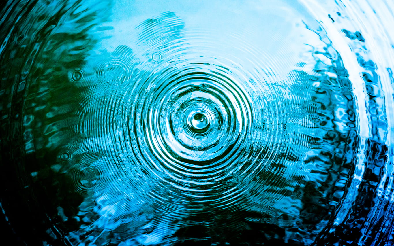 close up of a puddle with ripples