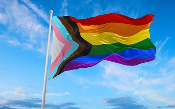 LGBTQ colourful flag with sky background