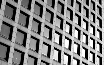 Monochrome image of a modern office building's exterior