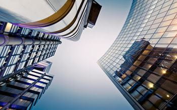 Modern office buildings against a blue sky