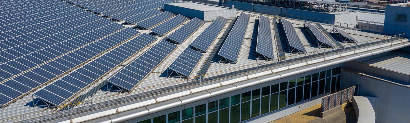 Solar panels on the roof of a large office building