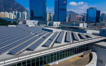 Solar panels on the roof of a large office building