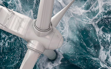 Aerial view of wind turbine in the ocean