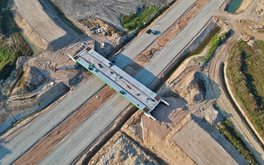 Aerial view on building site of road bridge for city road bypass