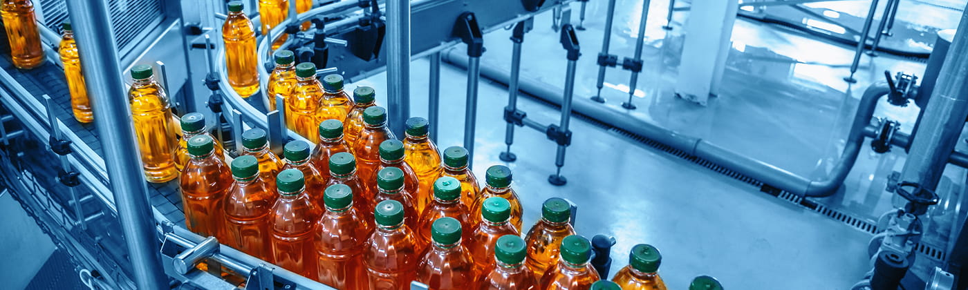 Bottled liquids on conveyer belt