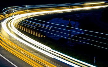 stopmotion image with yellow and white streams of light from traffic