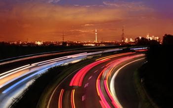 motion stop image of a highway against a cityscape