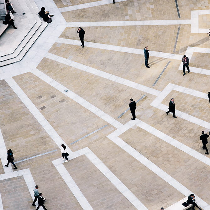 Aerial image of business people walking on the pavement