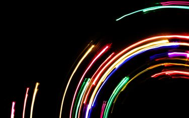 Multi-coloured LED lights spiralling in a circle