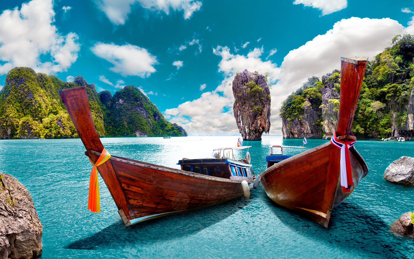 Thailand, two canoes on clear blue water