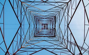Inside a transmission tower looking towards sky