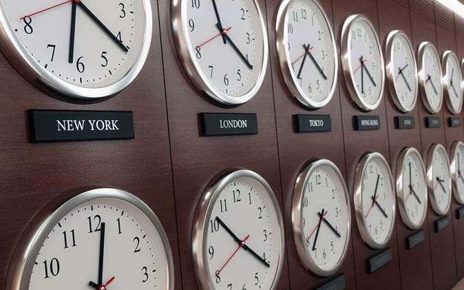 Clocks on a wall showing the time in major cities around the world