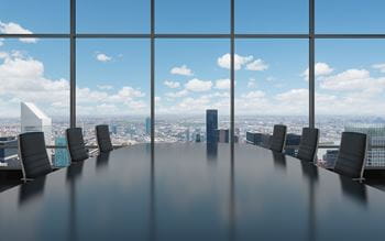 Boardroom with view of city and sky