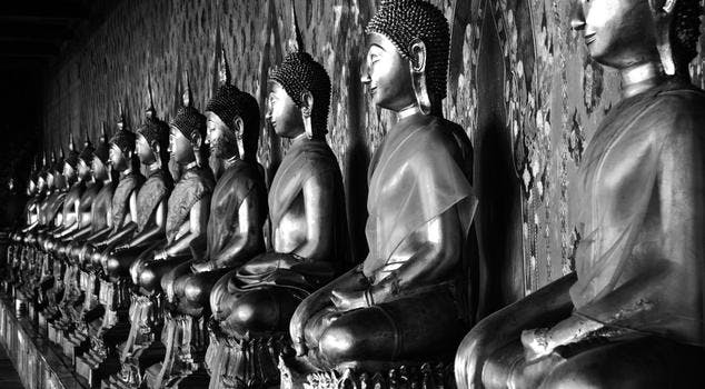 The long line of golden Buddhas in Wat Arun, The Temple of the Dawn, Bangkok.